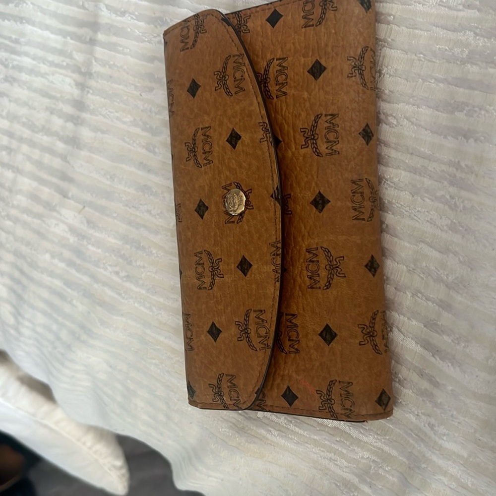 Classic MCM wallet with red accents.